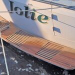 Boat stern with wooden swim platform.